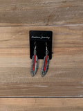 Silver and red beaded feather earrings