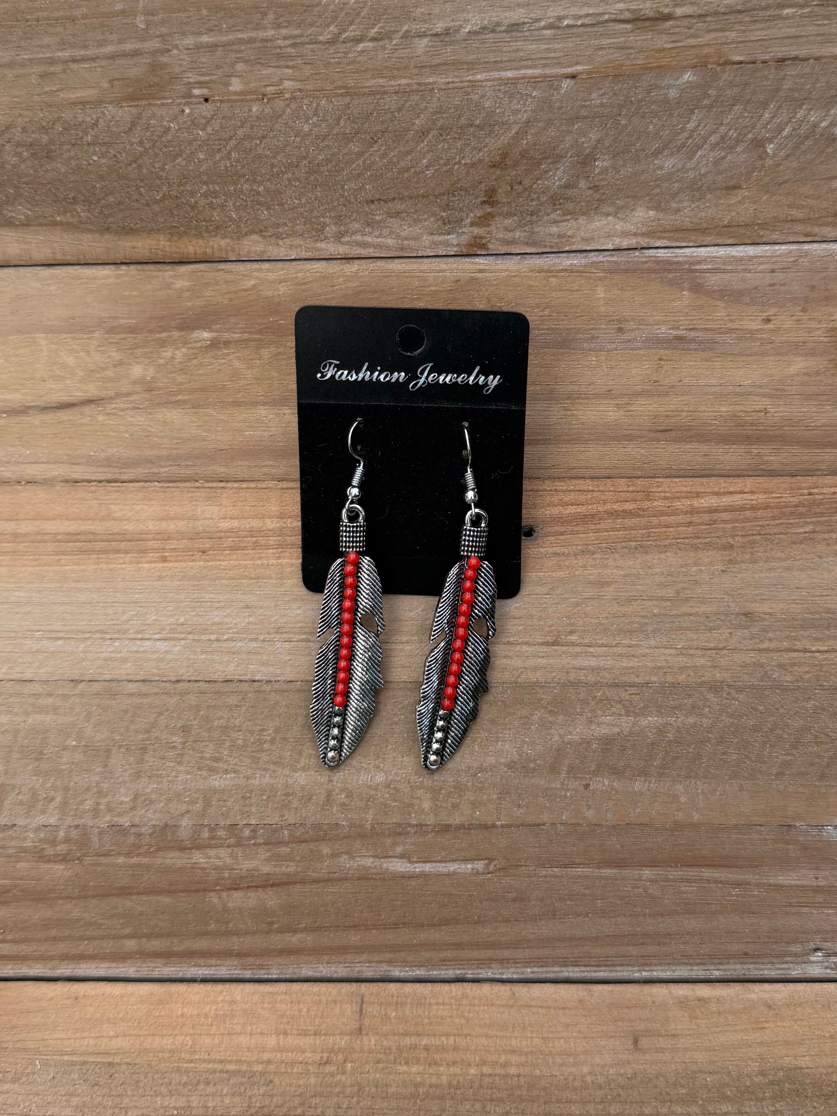 Silver and red beaded feather earrings